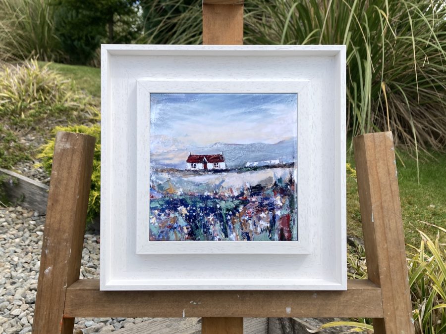 Framed ceramic tile wall art print of Scottish landscape painting featuring Highland glen and stone bothy cottage