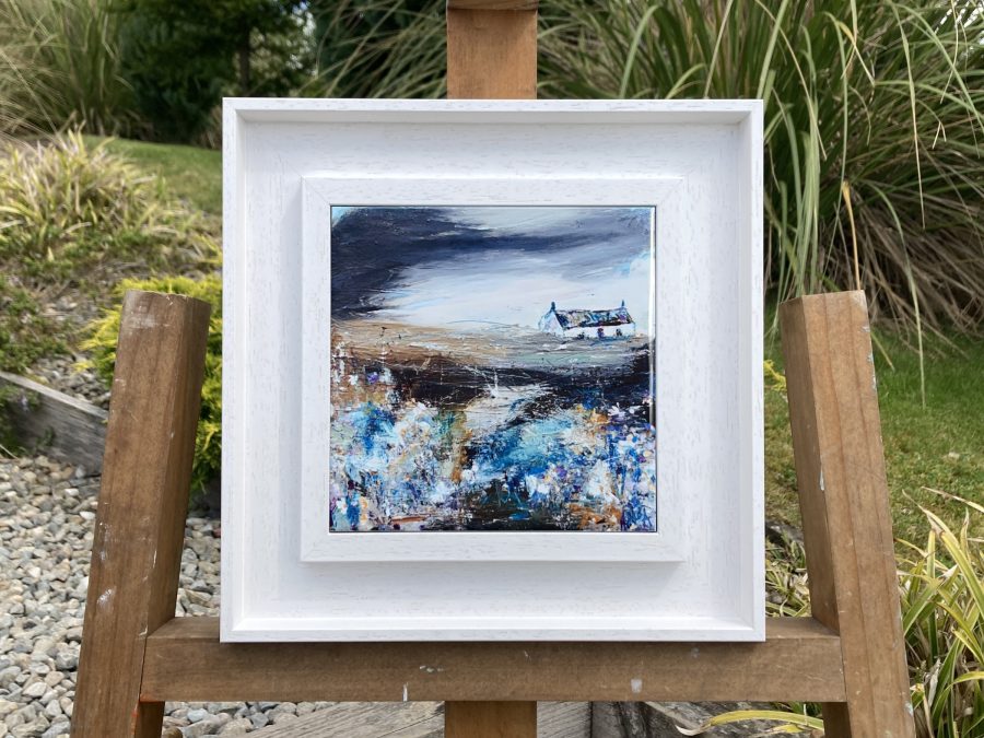 Framed ceramic tile wall art print of Scottish landscape painting featuring Highland glen and stone bothy cottage